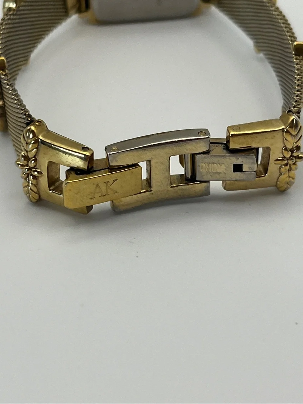 Anne Klein Women's Gold Mesh Bracelet Watch with Leaf Accents